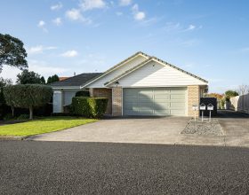 suburban garage with roller door under gabled roof